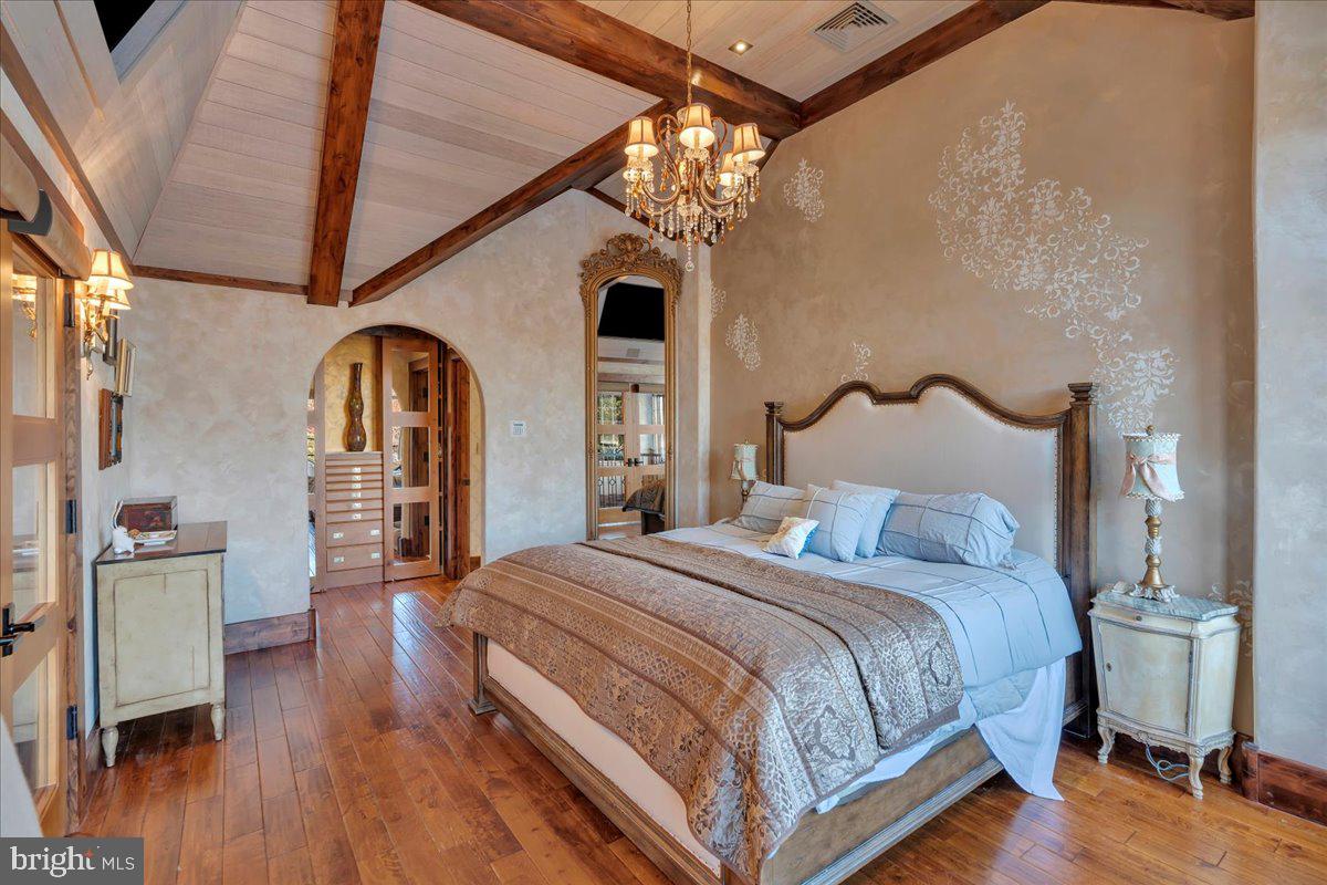 133 Stokes Road Medford Lakes, NJ 08055 - Photo 32 of 57 a bedroom with bed and wooden floor