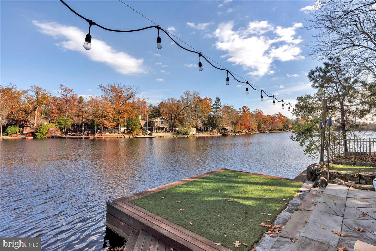 133 Stokes Road Medford Lakes, NJ 08055 - Photo 4 of 57 a view of a lake with a outdoor space