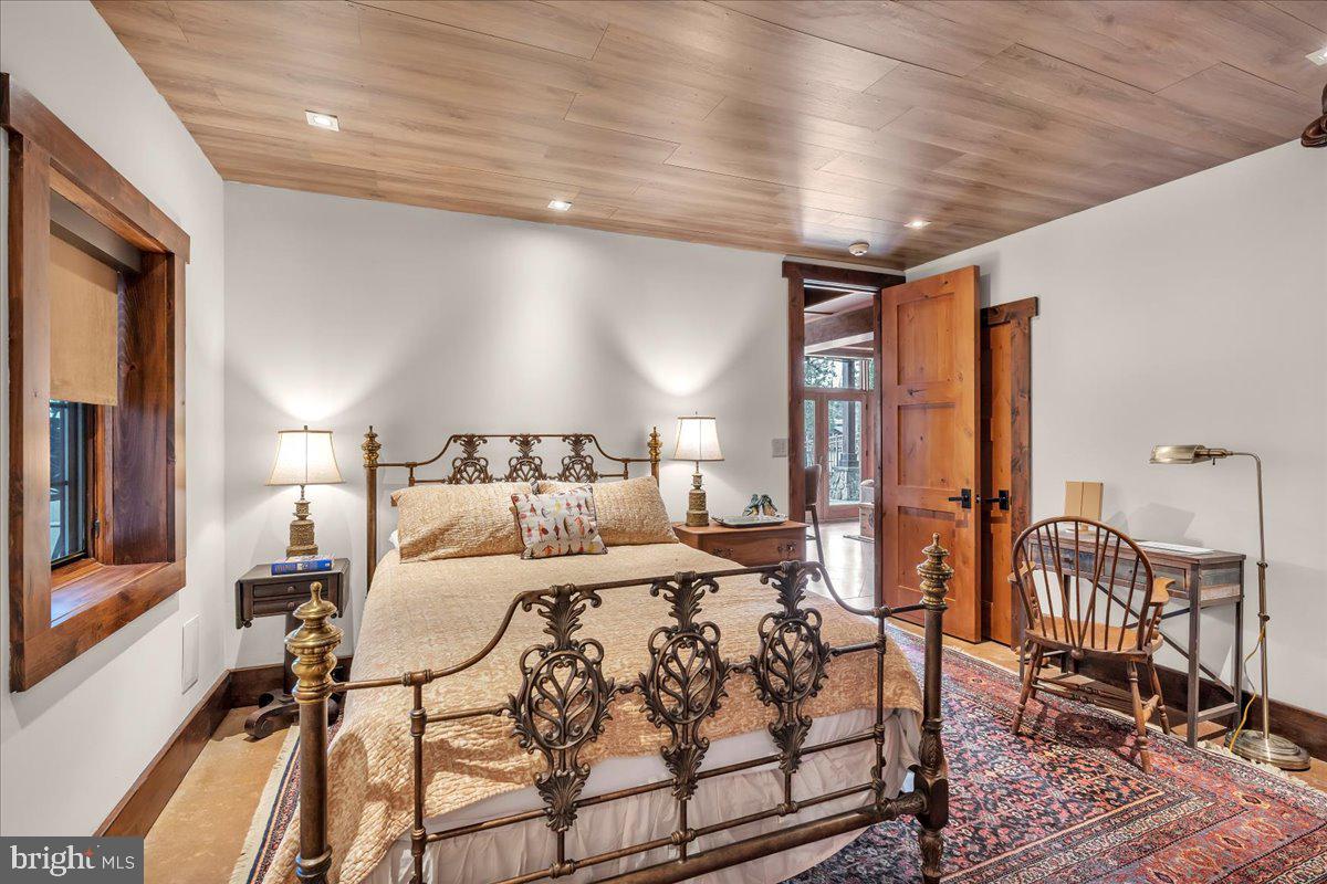 133 Stokes Road Medford Lakes, NJ 08055 - Photo 43 of 57 a bedroom with double bed and a night stand