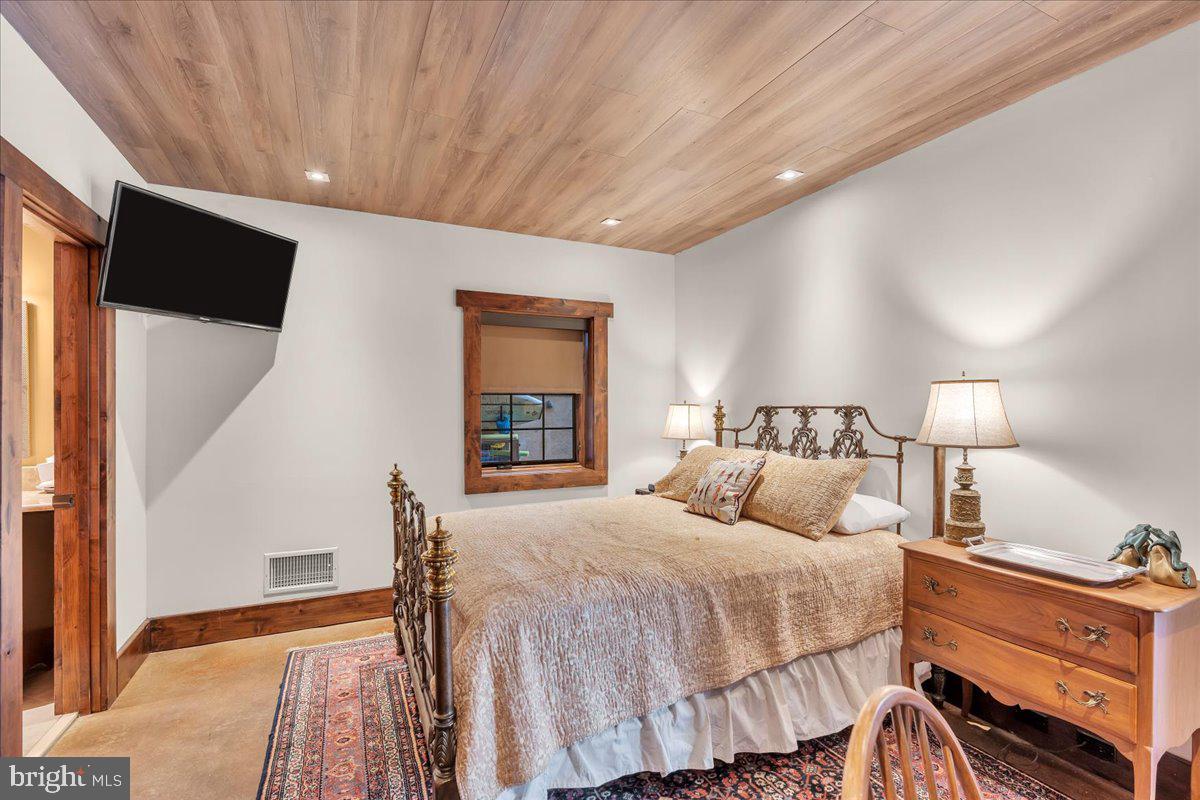 133 Stokes Road Medford Lakes, NJ 08055 - Photo 44 of 57 a bedroom with a large bed and a window