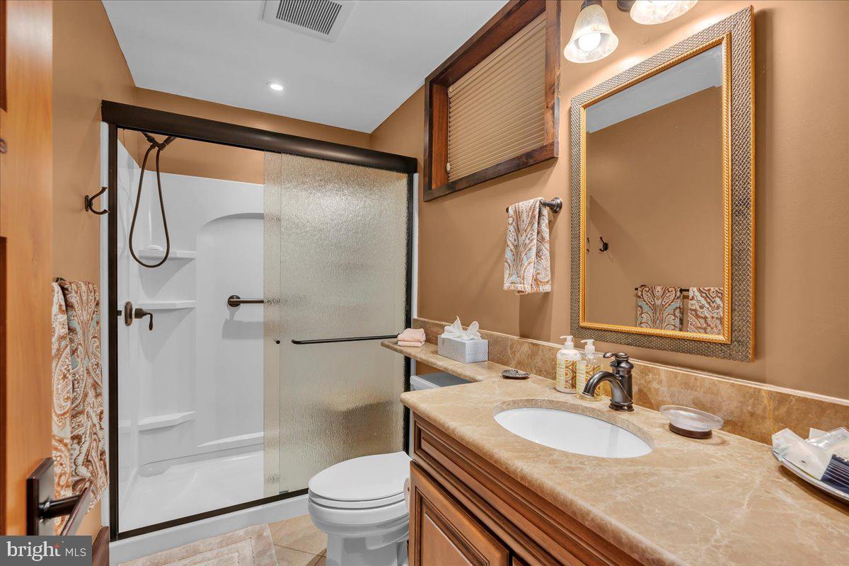 133 Stokes Road Medford Lakes, NJ 08055 - Photo 45 of 57 a bathroom with a sink and a mirror