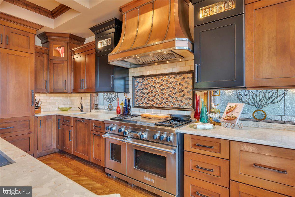 133 Stokes Road Medford Lakes, NJ 08055 - Photo 10 of 57 a kitchen with stainless steel appliances granite countertop a stove a sink and a microwave