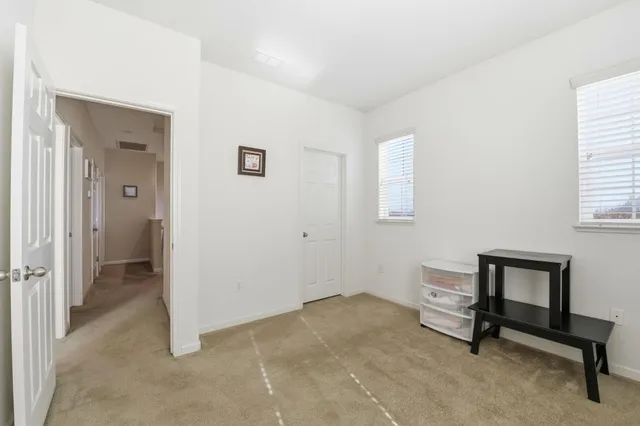 a bedroom with a bed and a closet