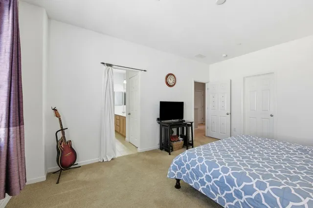 a bathroom with a sink mirror toilet and shower