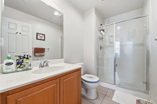 a bathroom with cabinets and mirror