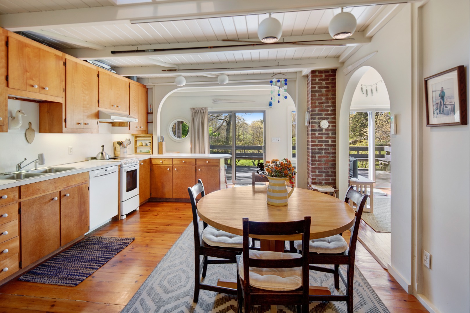 10 Abel's Neck Road Chilmark, MA 02535 - Photo 4 of 20 a view of a dining room with furniture and wooden floor