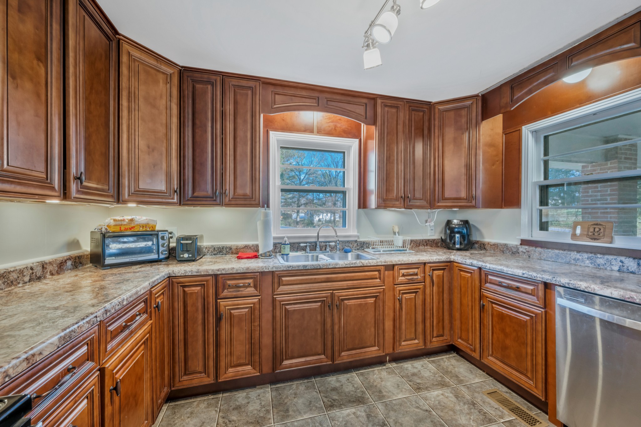 1555 Highway 13 Cunningham, TN 37052 - Photo 13 of 30 a kitchen with a sink stove and cabinets
