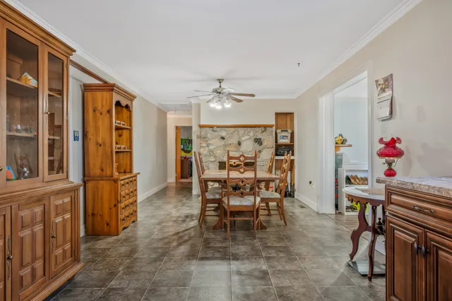 a view of a livingroom with furniture a flat screen tv and outdoor space