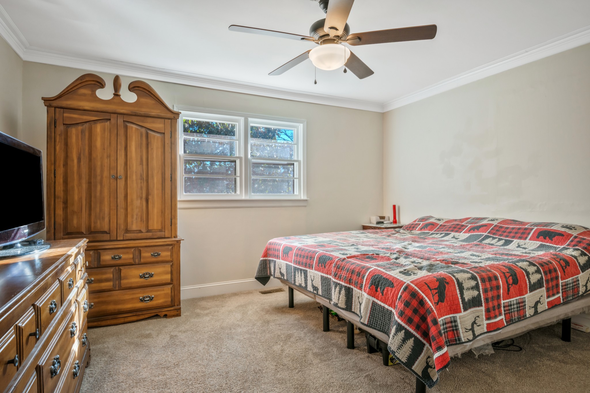 1555 Highway 13 Cunningham, TN 37052 - Photo 17 of 30 a bedroom with a bed and a chandelier