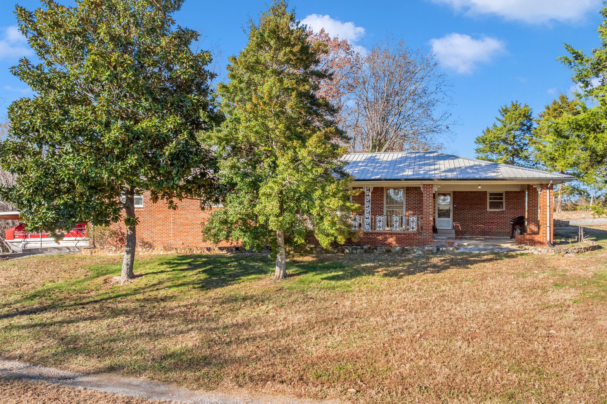 1555 Highway 13 Cunningham, TN 37052 - Photo 5 of 30 a front view of a house with a yard