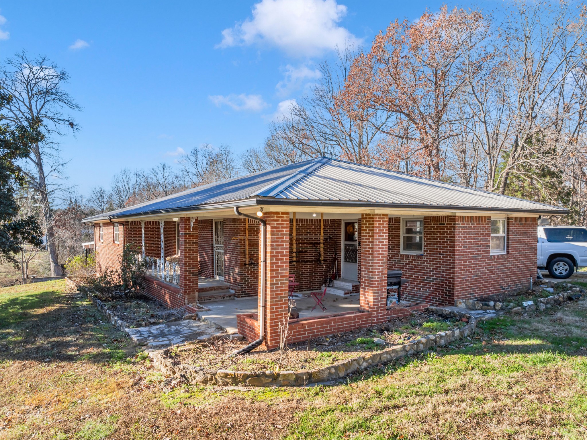 1555 Highway 13 Cunningham, TN 37052 - Photo 7 of 30 a front view of a house with garden