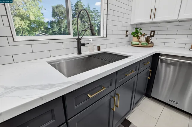 a kitchen with a sink and a window