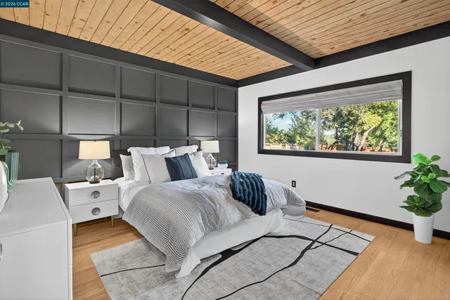 a dining room with furniture and wooden floor