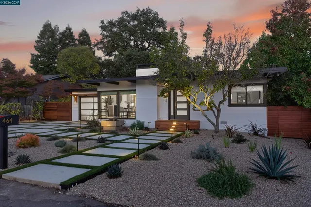 a swimming pool view with plants and trees
