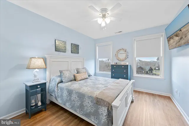 a bedroom with a bed and a table in it