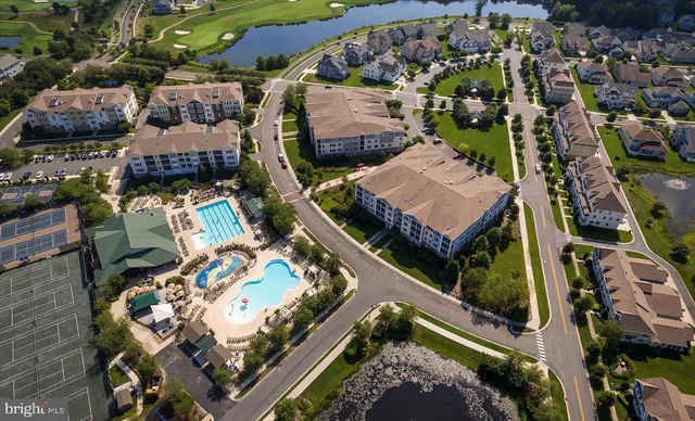 an aerial view of houses with outdoor space