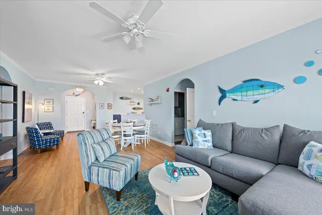 a living room with furniture a table and a fireplace