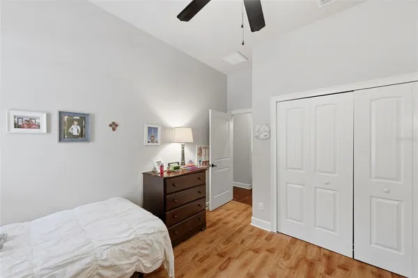 a bedroom with a bed and a chandelier
