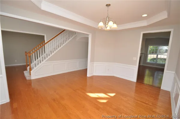 a view of an entryway with wooden floor