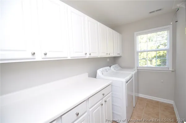 a utility room with cabinets