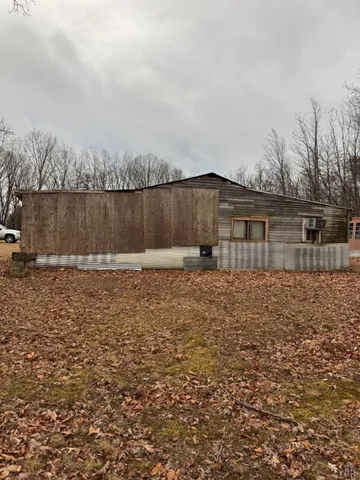 a view of a backyard of the house