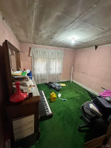 a living room with a couch and a stove