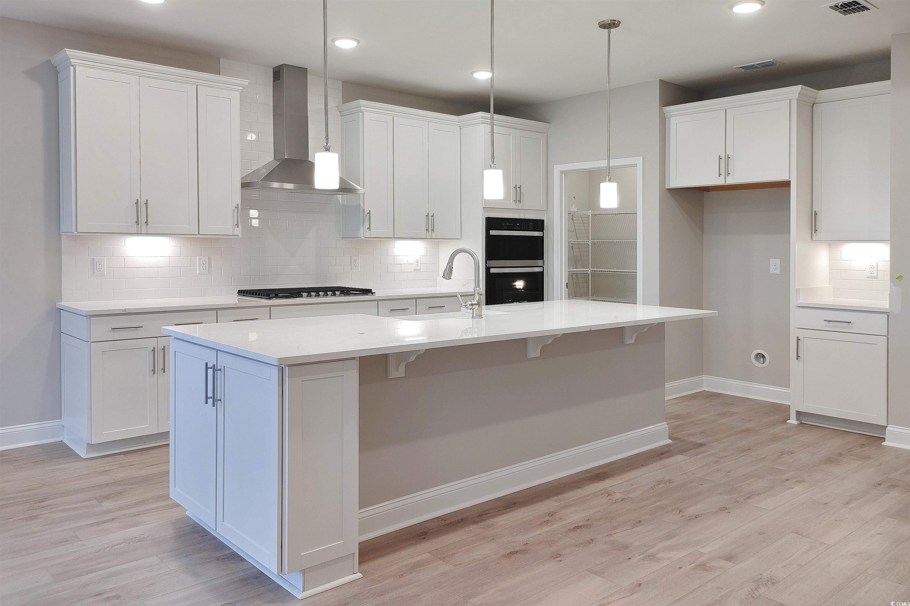 1604 Littleleaf Loop North Myrtle Beach, SC 29582 - Photo 5 of 40 Kitchen featuring light wood-type flooring, tastef