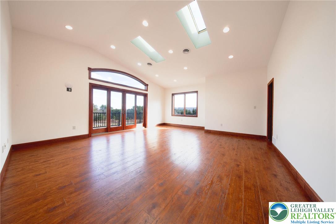 374 Packer Drive Weatherly, PA 18255 - Photo 18 of 33 a view of an empty room with wooden floor and a window