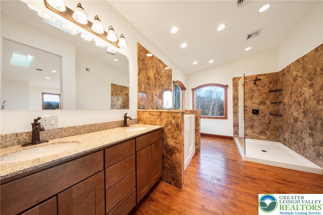 374 Packer Drive Weatherly, PA 18255 - Photo 21 of 33 a spacious bathroom with a granite countertop sink mirror and shower
