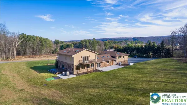 a view of a house with a big yard