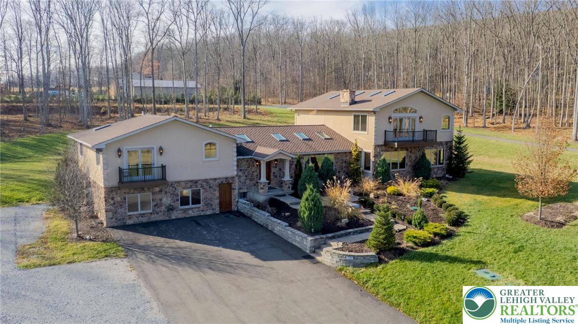 374 Packer Drive Weatherly, PA 18255 - Photo 6 of 33 a front view of a house with garden