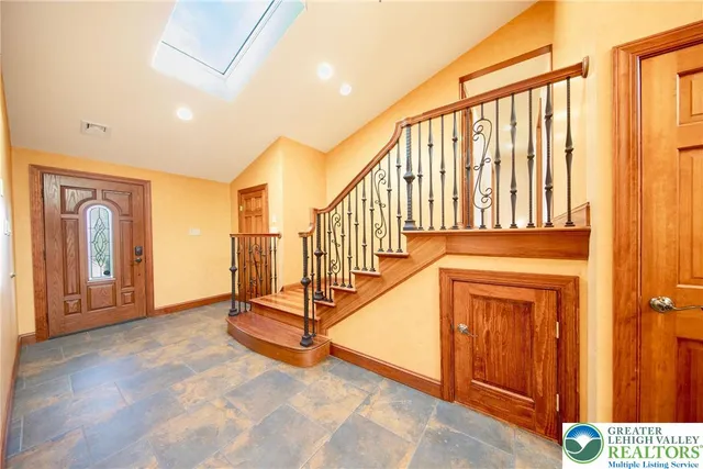 a view of an entryway with a hallway