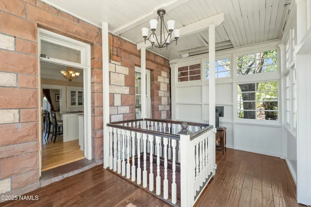 a view of a house with swimming pool and sitting area