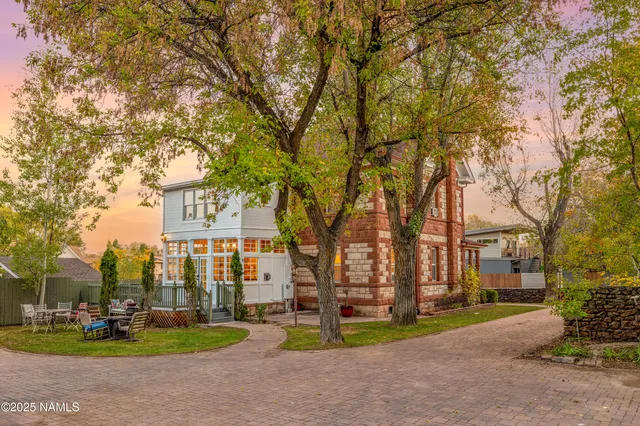 a living room with furniture fireplace and a flat screen tv
