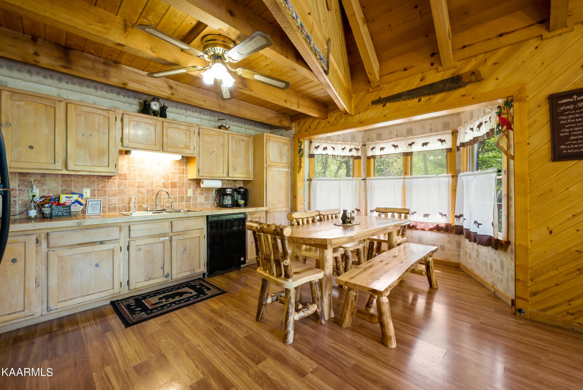 3138 North Clear Fork Road Sevierville, TN 37862 - Photo 13 of 35 a kitchen with sink cabinets and wooden floor