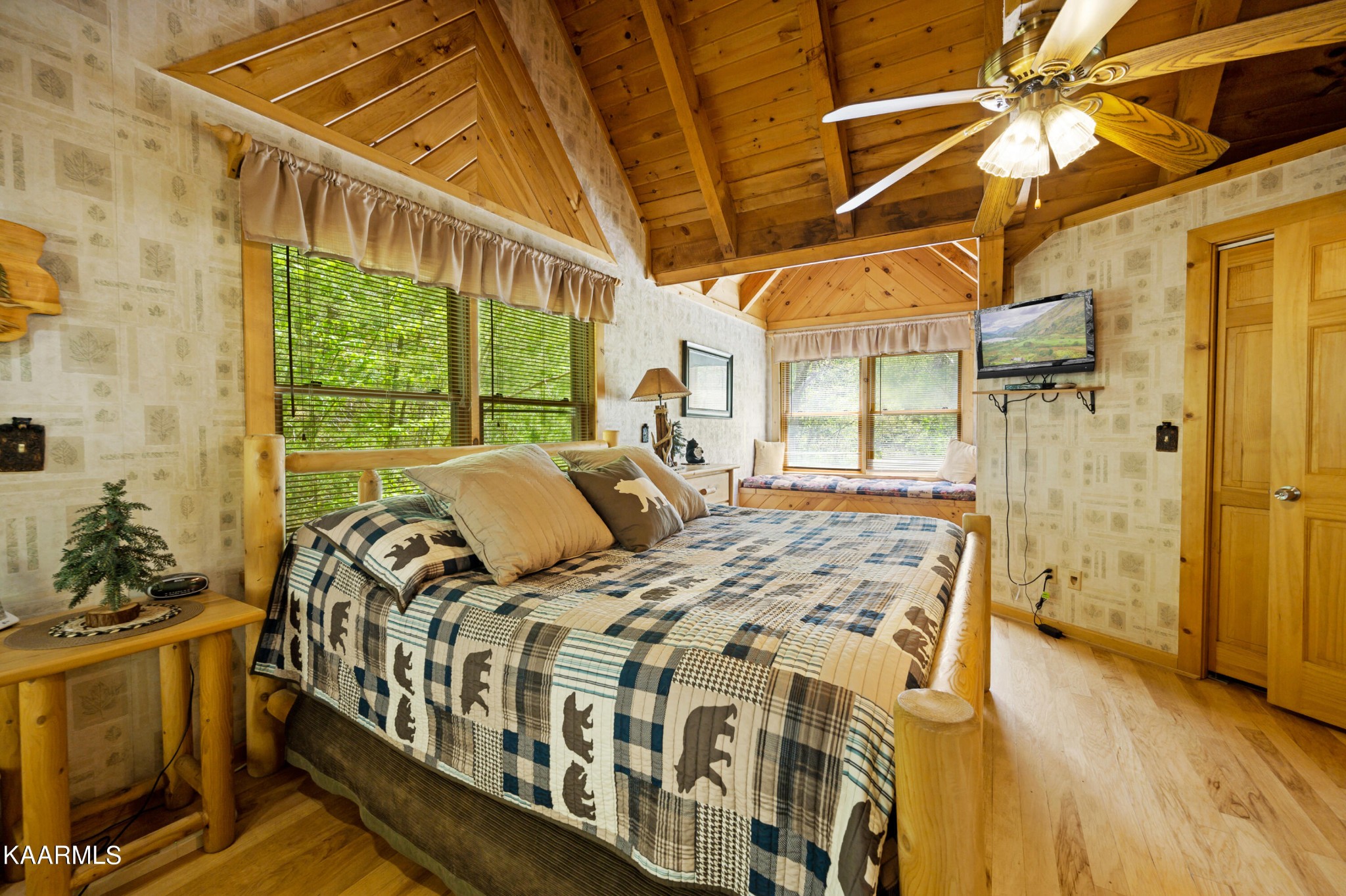 3138 North Clear Fork Road Sevierville, TN 37862 - Photo 28 of 35 a bed sitting in a bedroom next to a window