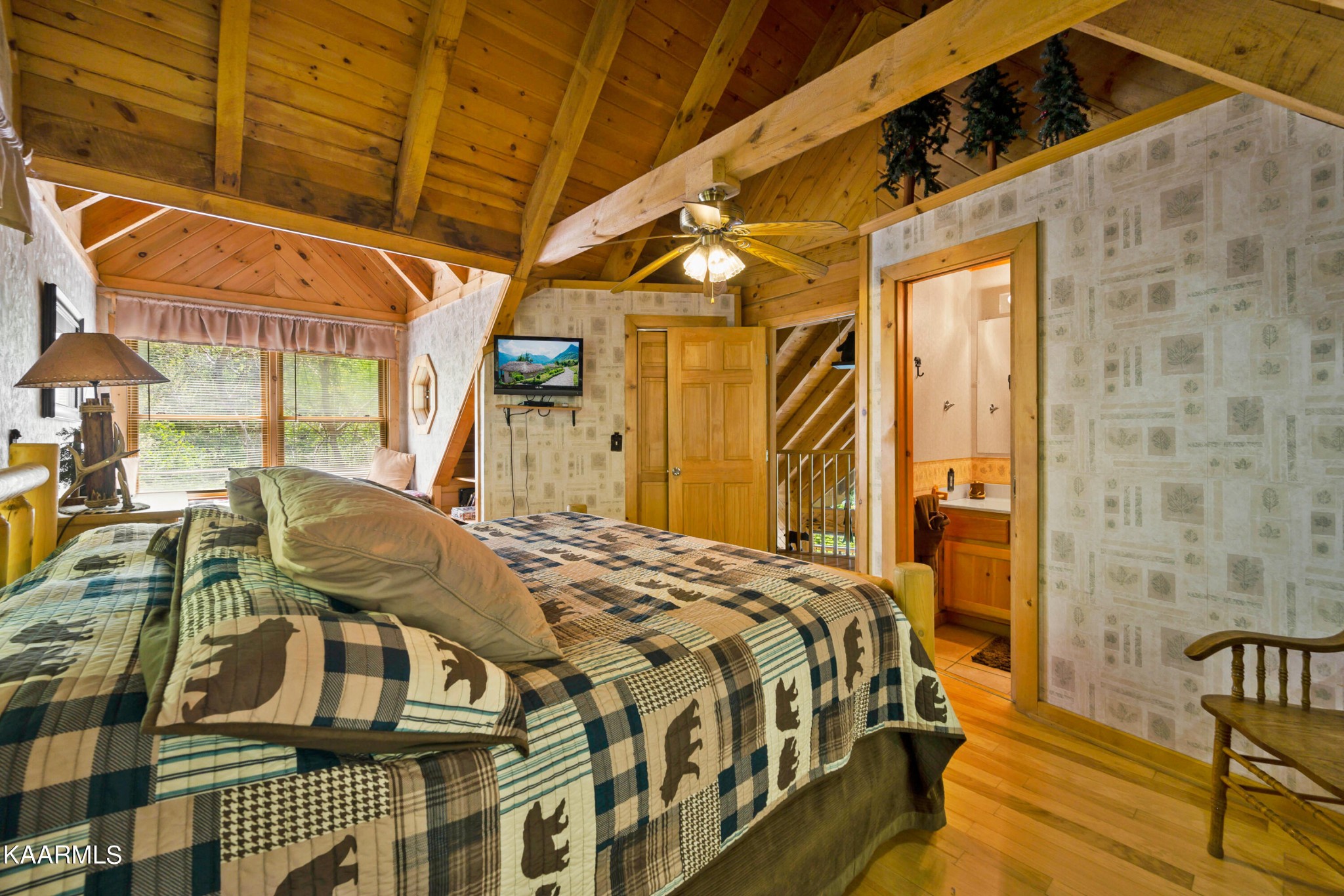 3138 North Clear Fork Road Sevierville, TN 37862 - Photo 30 of 35 a bedroom with a bed next to a window