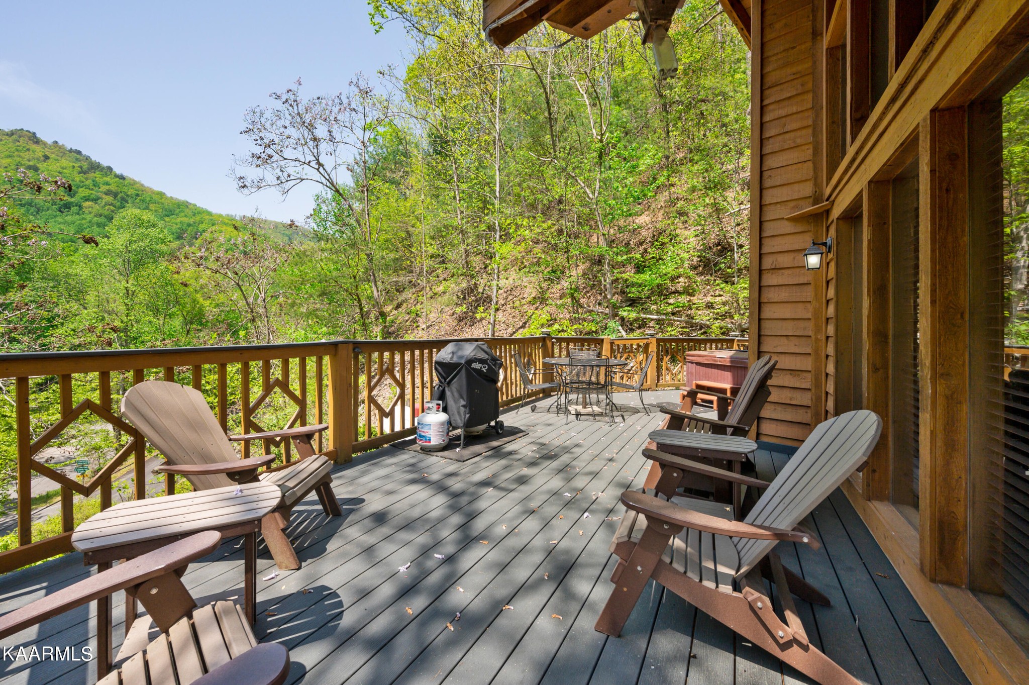 3138 North Clear Fork Road Sevierville, TN 37862 - Photo 33 of 35 a balcony with wooden floor table and chairs