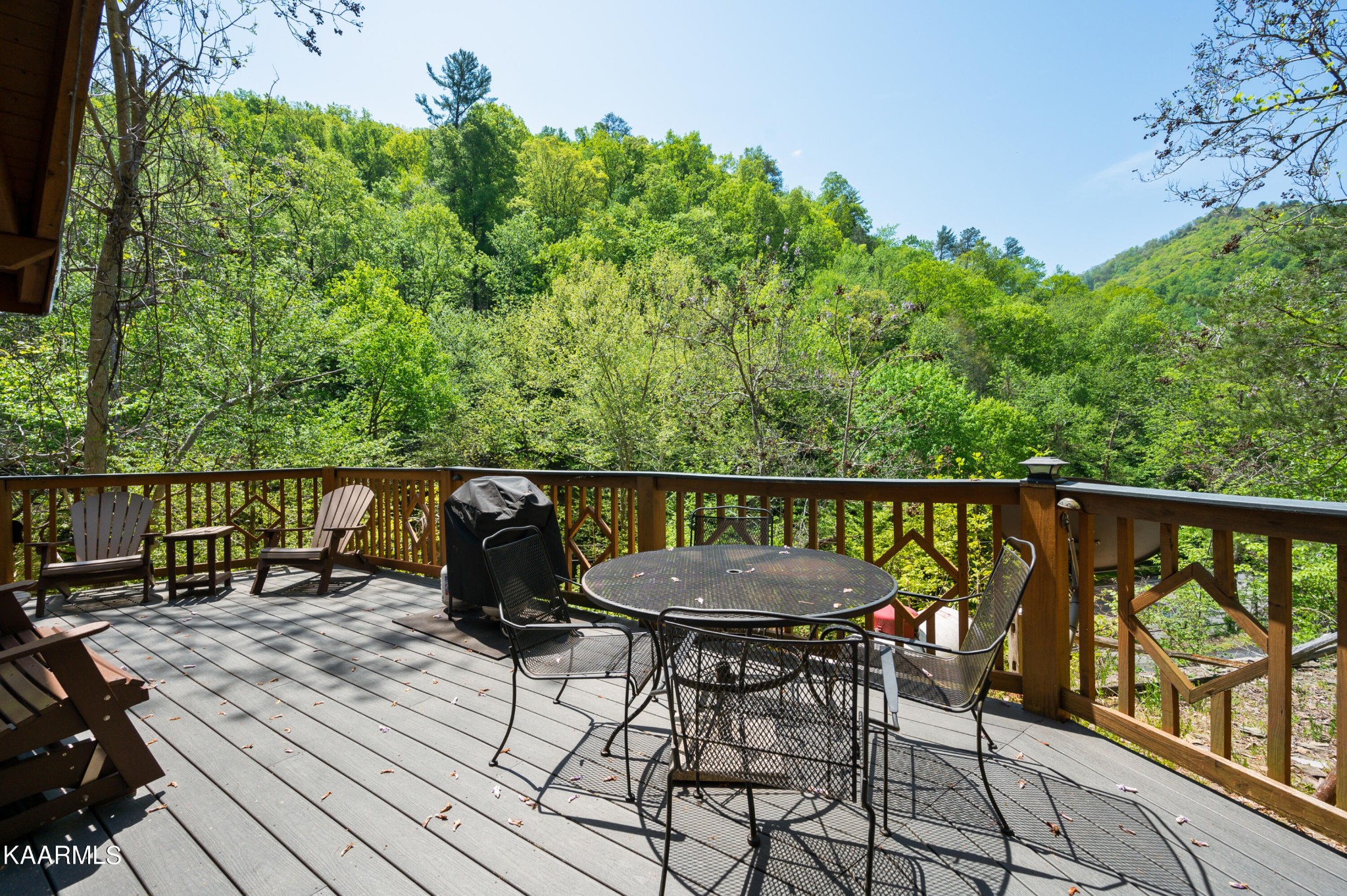 3138 North Clear Fork Road Sevierville, TN 37862 - Photo 35 of 35 a balcony with wooden floor table and chairs