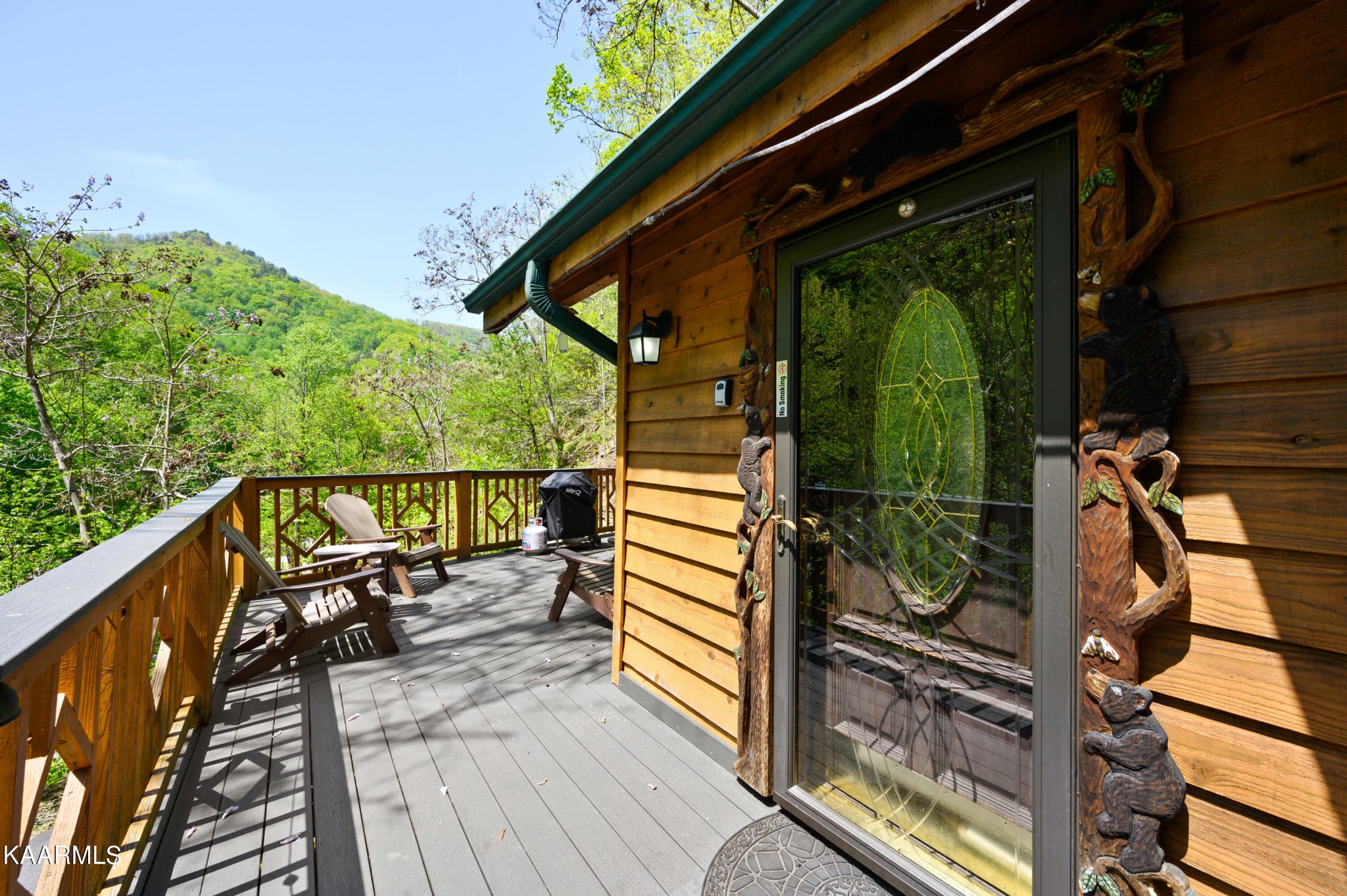 3138 North Clear Fork Road Sevierville, TN 37862 - Photo 5 of 35 a view of a balcony with chairs and wooden floor