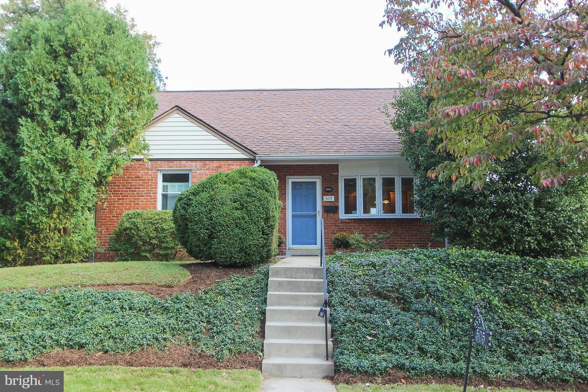 505 Kerwin Court Silver Spring, MD 20901 - Photo 1 of 27 a front view of a house with a yard and potted plants