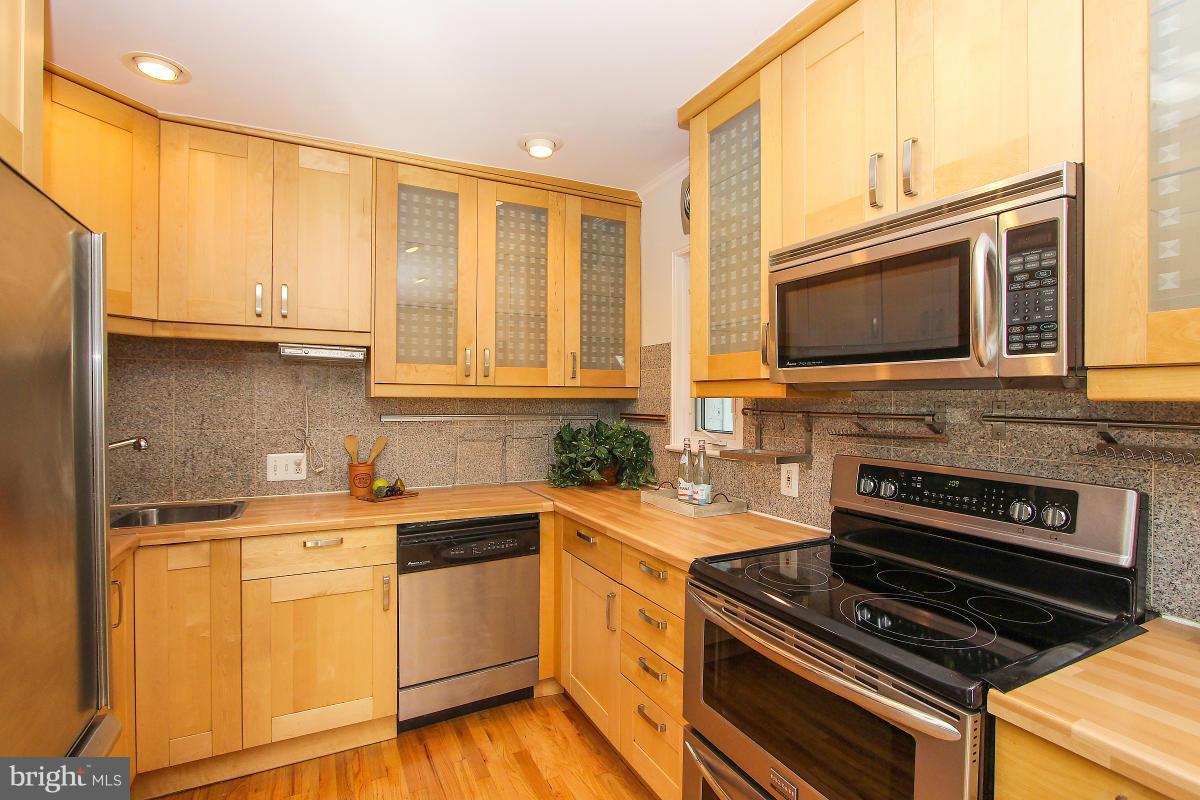 505 Kerwin Court Silver Spring, MD 20901 - Photo 11 of 27 a kitchen with a stove a sink and a microwave