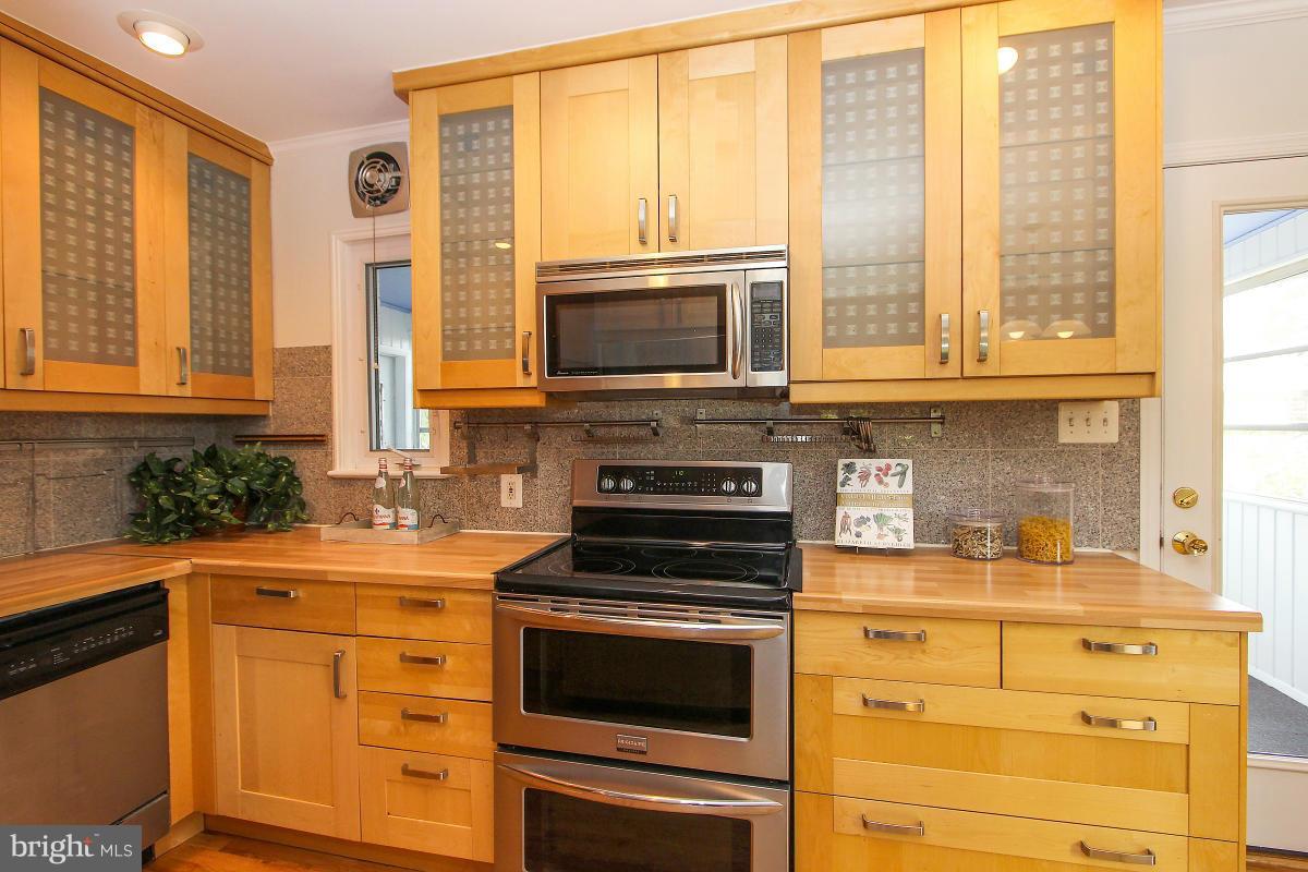 505 Kerwin Court Silver Spring, MD 20901 - Photo 12 of 27 a kitchen with a stove a sink and a microwave