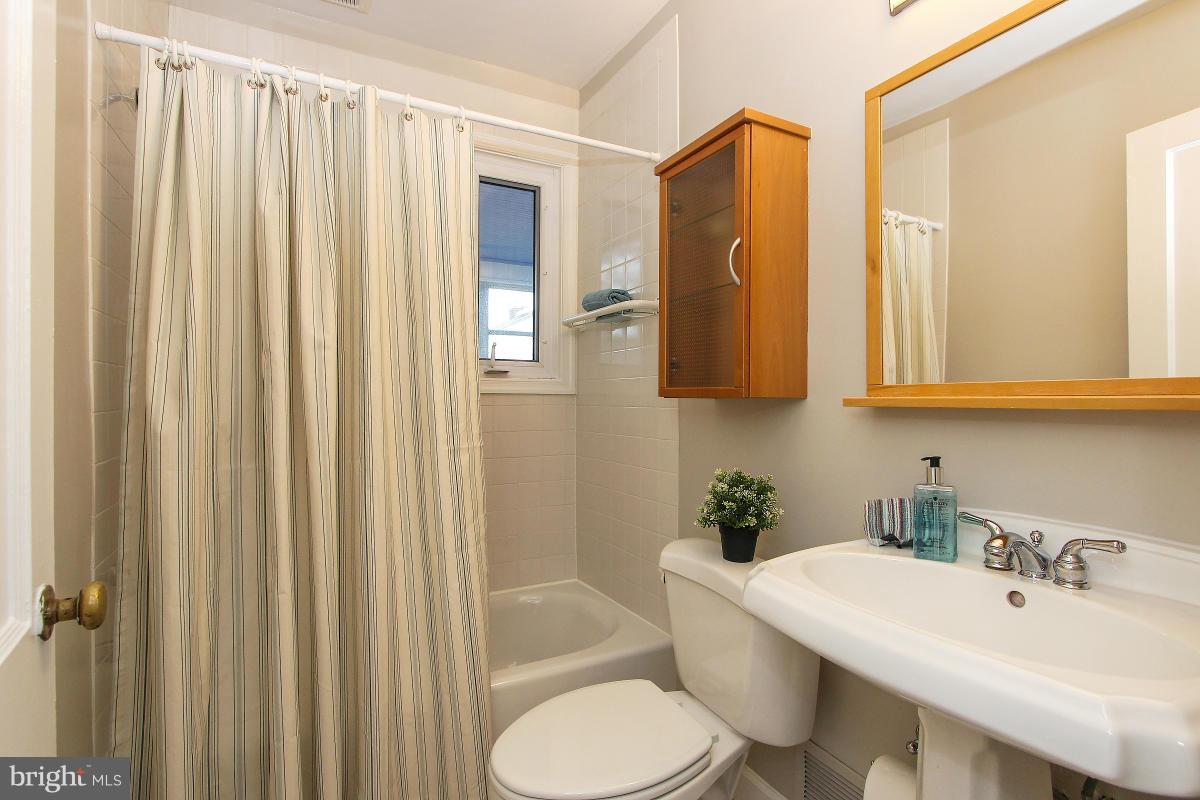 505 Kerwin Court Silver Spring, MD 20901 - Photo 17 of 27 a bathroom with a sink toilet and shower