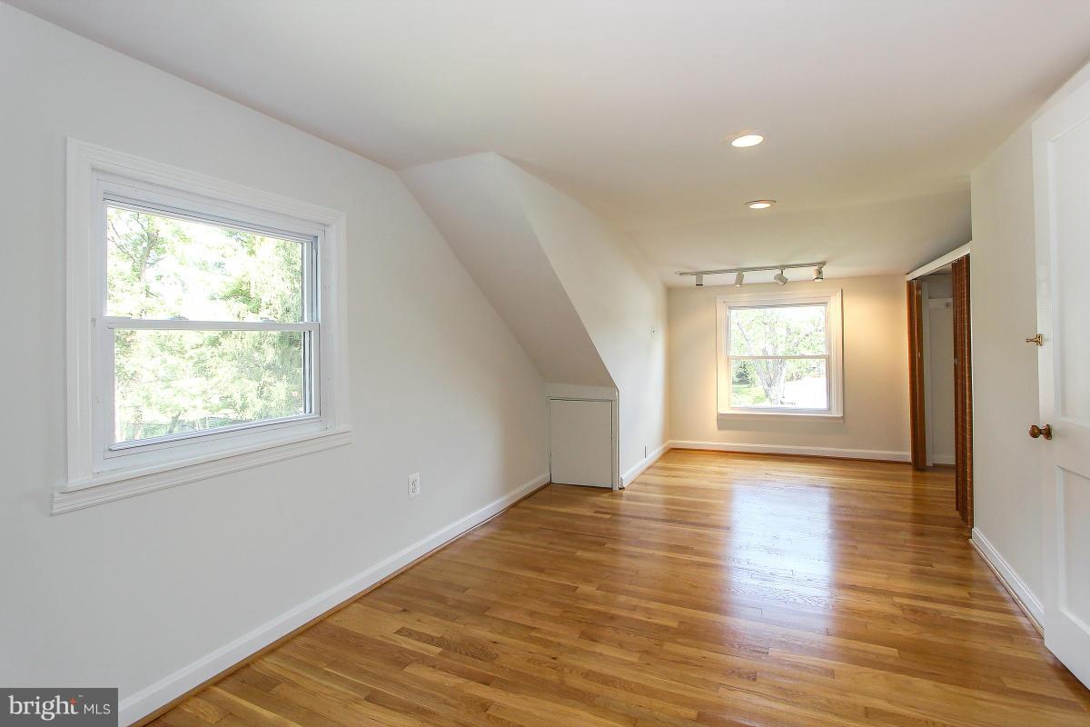 505 Kerwin Court Silver Spring, MD 20901 - Photo 18 of 27 a view of an empty room with wooden floor and a window