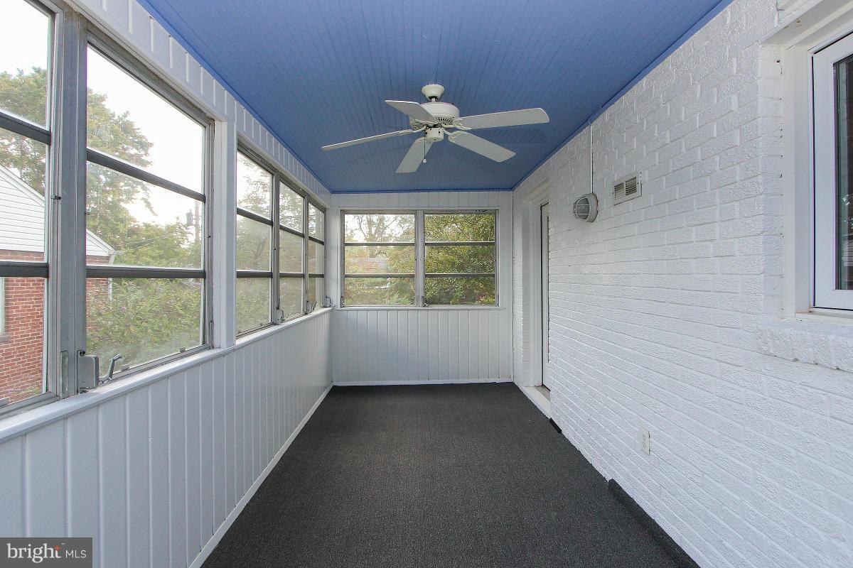 505 Kerwin Court Silver Spring, MD 20901 - Photo 25 of 27 wooden floor in an empty room with a window