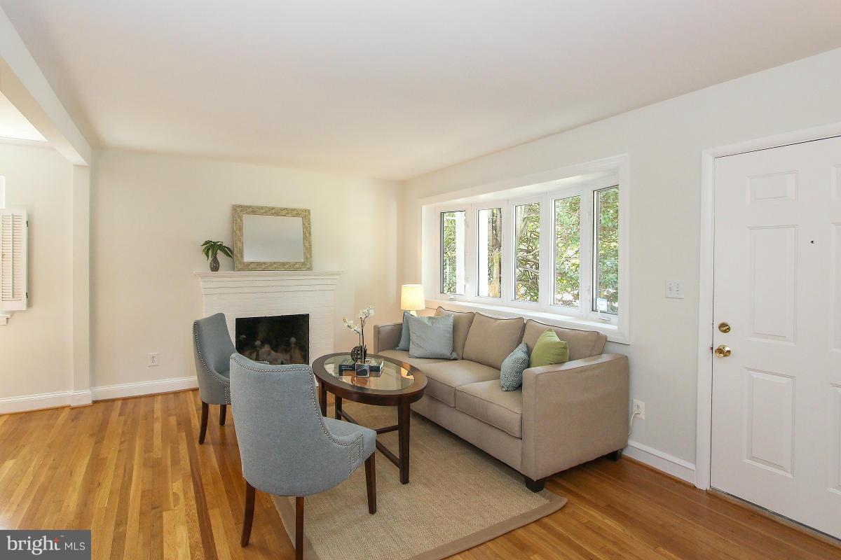 505 Kerwin Court Silver Spring, MD 20901 - Photo 5 of 27 a living room with furniture and a fireplace