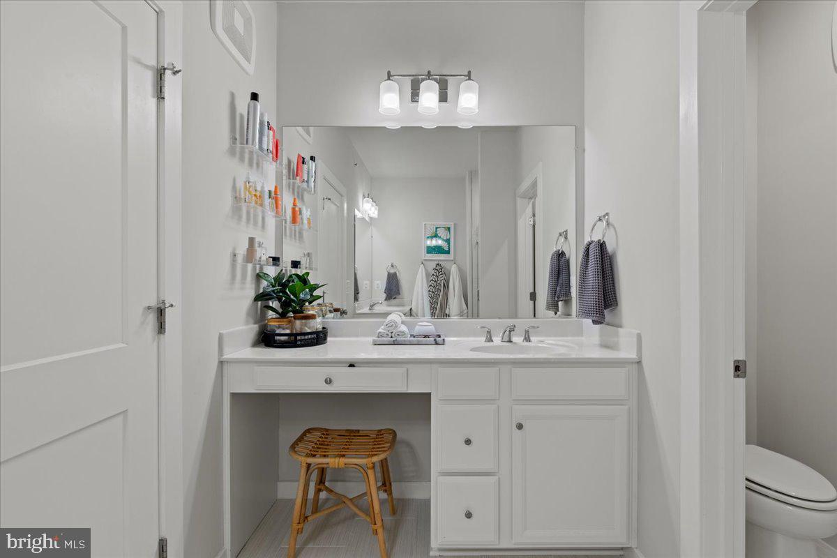 44614 Wolfhound Square Ashburn, VA 20147 - Photo 29 of 48 a bathroom with a sink and a mirror