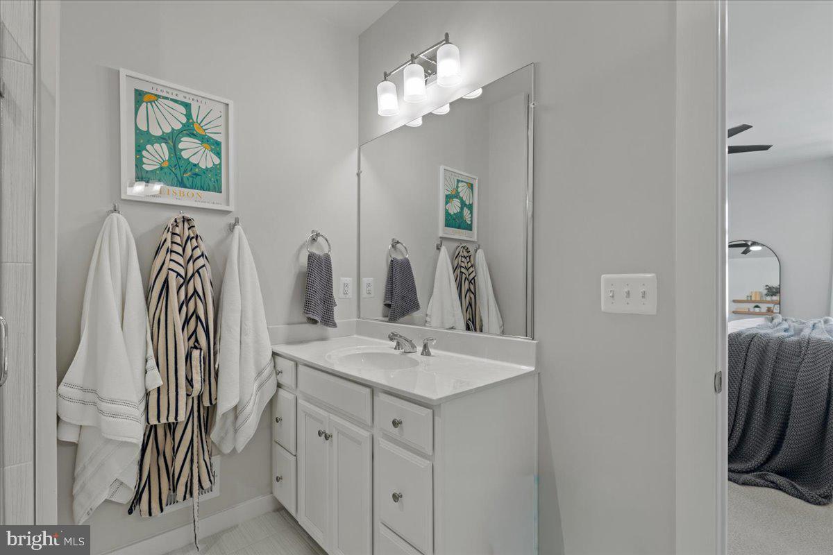44614 Wolfhound Square Ashburn, VA 20147 - Photo 30 of 48 a bathroom with a sink vanity and a mirror