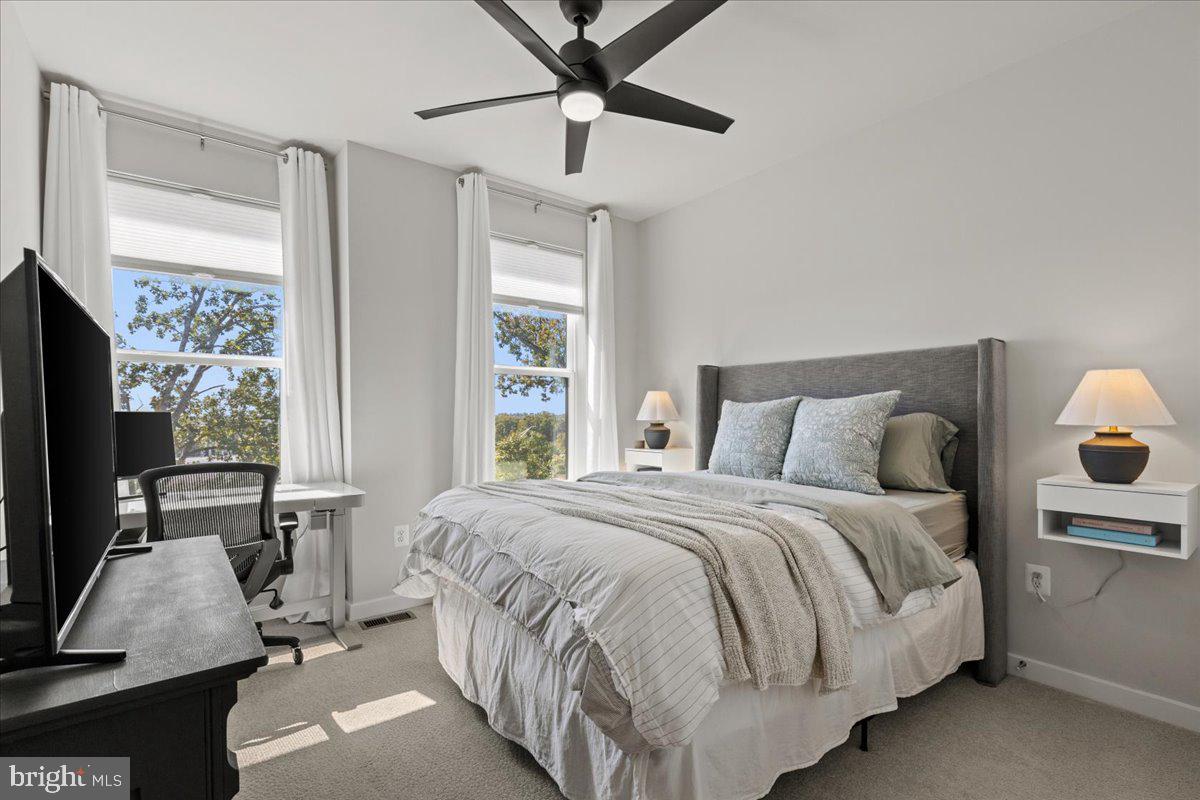 44614 Wolfhound Square Ashburn, VA 20147 - Photo 33 of 48 a bedroom with a bed tv and window